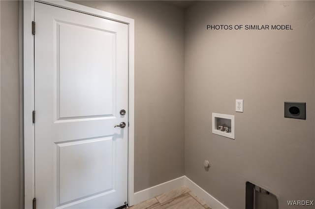 washroom with laundry area, baseboards, hookup for a gas dryer, hookup for a washing machine, and electric dryer hookup