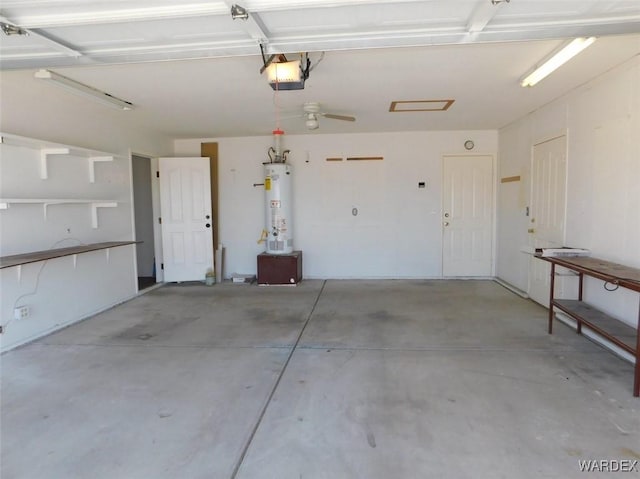 garage featuring water heater and a garage door opener