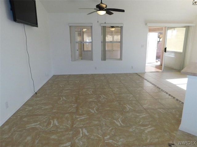 unfurnished room with a ceiling fan