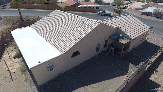 birds eye view of property with a residential view