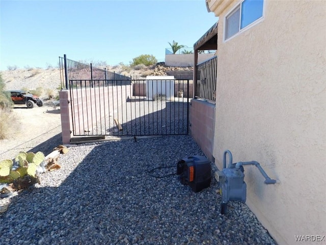 view of gate featuring fence