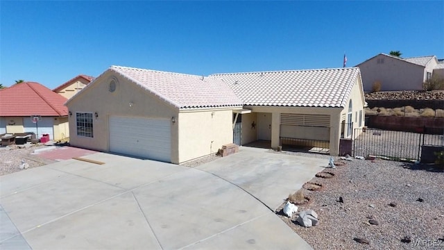 ranch-style house with a garage, a tiled roof, fence, and stucco siding