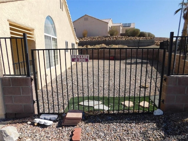 view of gate featuring fence