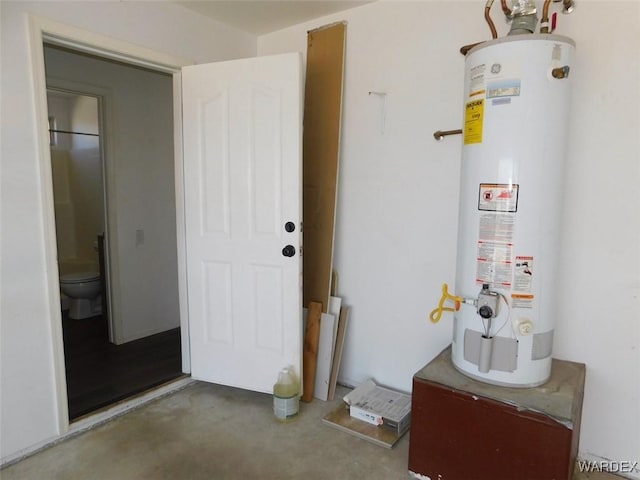 utility room featuring water heater