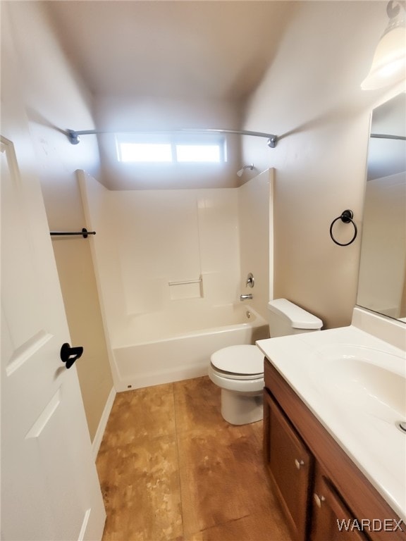 bathroom with toilet, tub / shower combination, and vanity