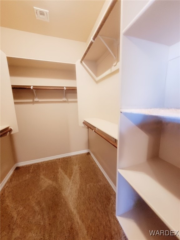 spacious closet with carpet and visible vents