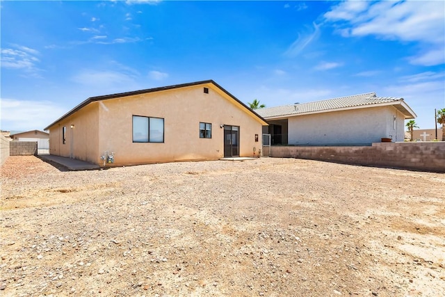 3741 June St, Bullhead City, AZ 86442 - back of house with stucco siding and fence