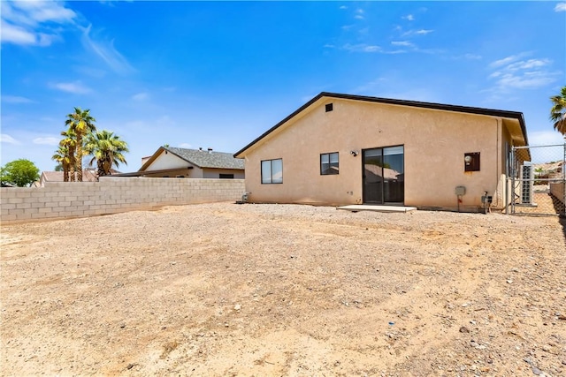 3741 June St, Bullhead City, AZ 86442 - rear view of house featuring stucco siding and a fenced backyard