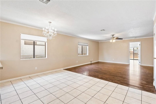 3741 June St, Bullhead City, AZ 86442 - unfurnished room featuring light wood-style floors, ceiling fan, ornamental molding, plenty of natural light, and a chandelier
