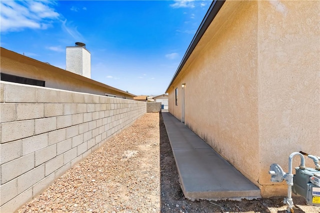 3741 June St, Bullhead City, AZ 86442 - view of home's exterior with fence and stucco siding