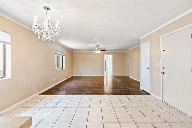 3741 June St, Bullhead City, AZ 86442 - spare room featuring crown molding, light wood-type flooring, a ceiling fan, a chandelier, and baseboards