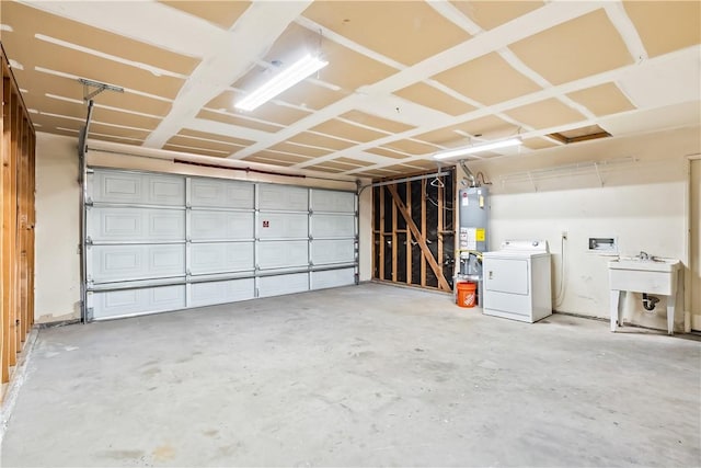 3741 June St, Bullhead City, AZ 86442 - garage with washer / dryer, water heater, and a sink