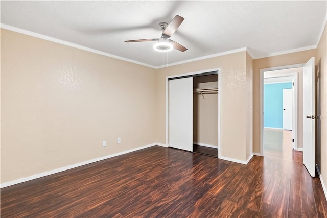 3741 June St, Bullhead City, AZ 86442 - unfurnished bedroom with dark wood-type flooring, crown molding, baseboards, a closet, and ceiling fan