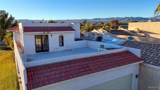 view of swimming pool with a mountain view