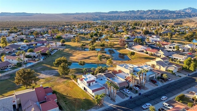 drone / aerial view featuring a residential view and a mountain view