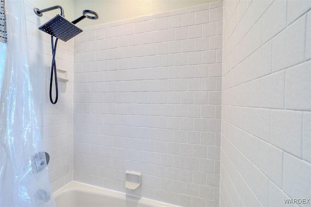 bathroom featuring shower / bath combo with shower curtain