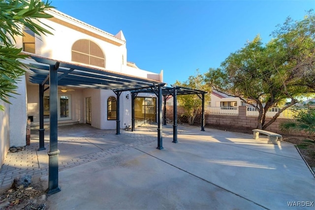 view of patio with fence and a pergola