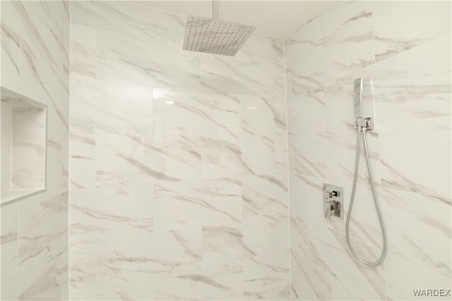 full bath with a marble finish shower