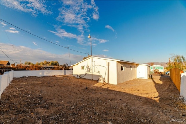 exterior space with a fenced backyard