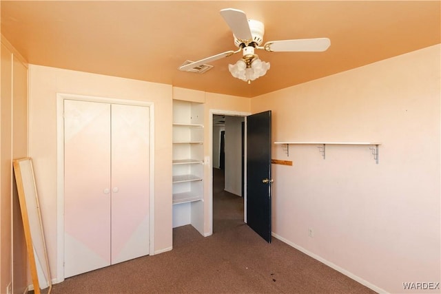 unfurnished bedroom with ceiling fan, carpet floors, visible vents, baseboards, and a closet