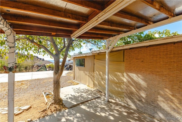 view of patio / terrace featuring fence