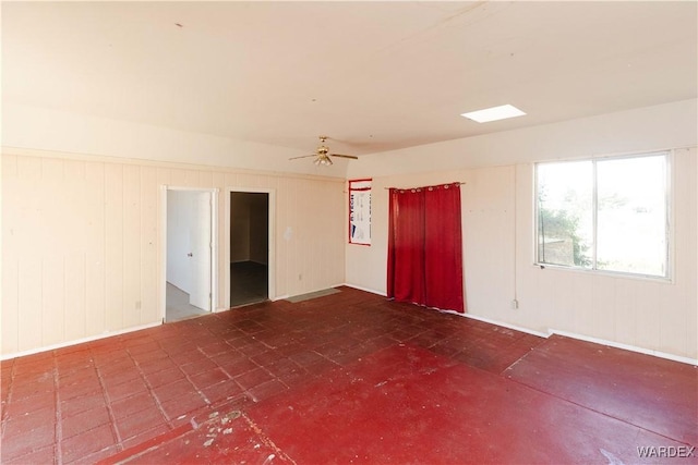 unfurnished room with ceiling fan