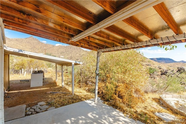 view of patio / terrace featuring a mountain view