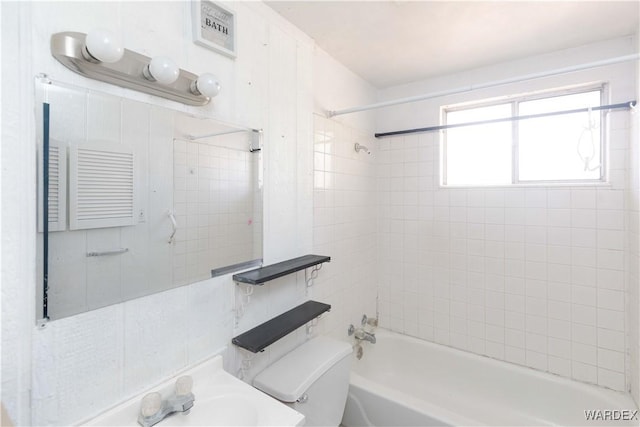 bathroom with shower / washtub combination and toilet