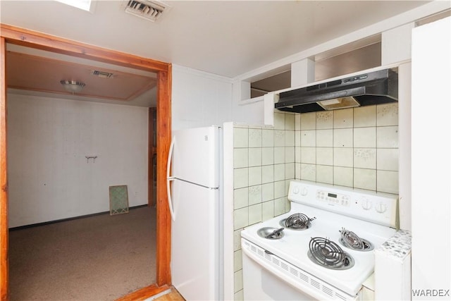 kitchen featuring white appliances, under cabinet range hood, visible vents, and light countertops