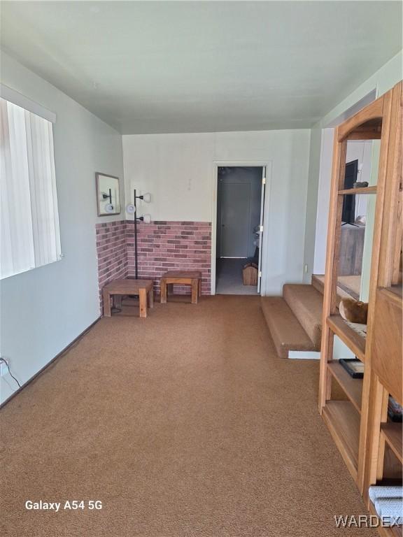 living area featuring carpet flooring