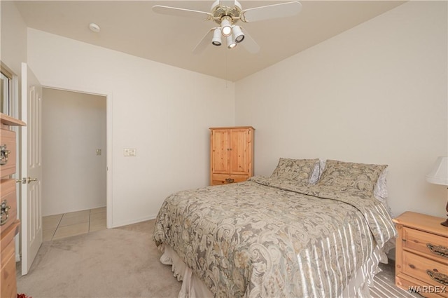 bedroom with ceiling fan and light colored carpet