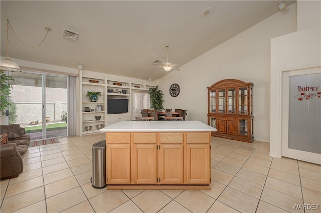 kitchen featuring light tile patterned floors, visible vents, a ceiling fan, open floor plan, and light countertops