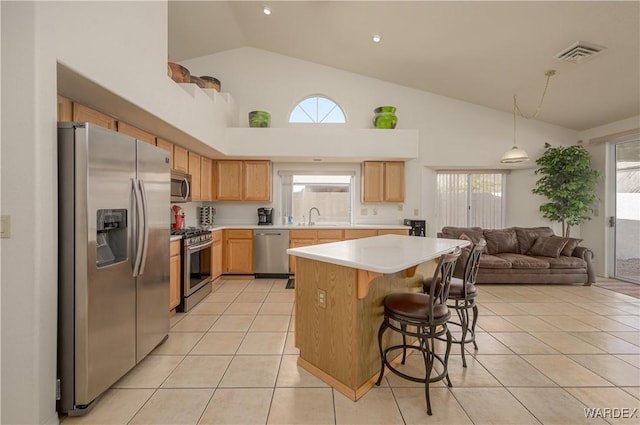 kitchen featuring light tile patterned floors, visible vents, stainless steel appliances, light countertops, and a sink