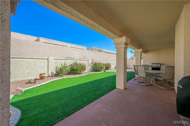 view of patio / terrace featuring outdoor dining space and a fenced backyard