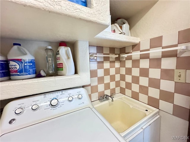 laundry room with washer / clothes dryer, a sink, and laundry area