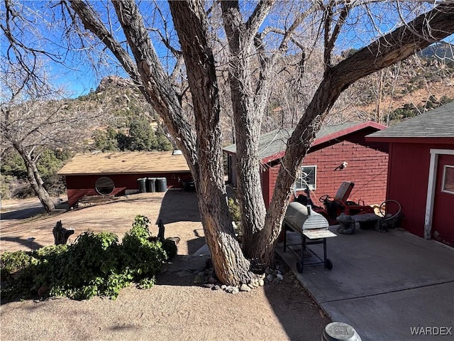 exterior space featuring a patio area and a mountain view