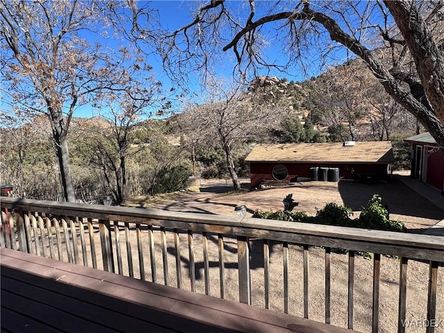 wooden terrace featuring a mountain view