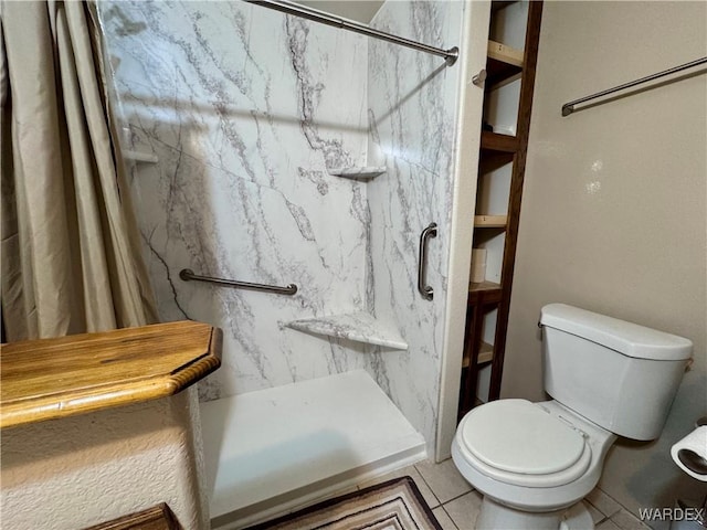 full bath with tile patterned flooring, a shower stall, and toilet