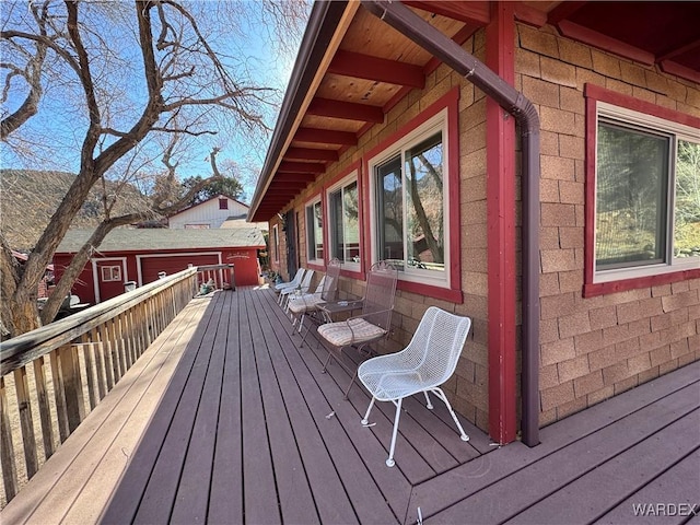 wooden terrace with an outdoor structure