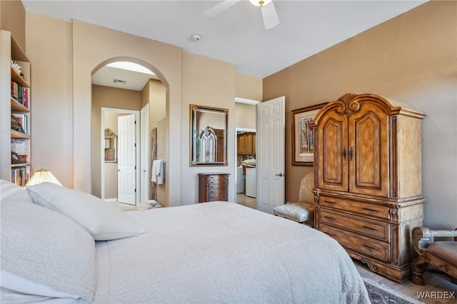 bedroom featuring arched walkways, ceiling fan, and visible vents