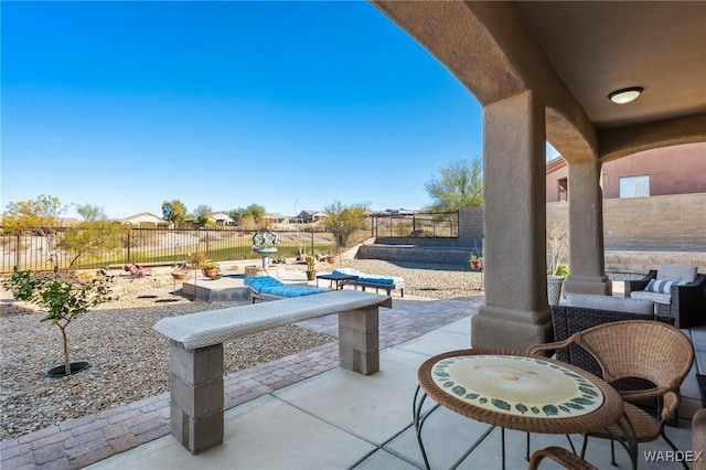 view of patio featuring a fenced backyard and outdoor lounge area