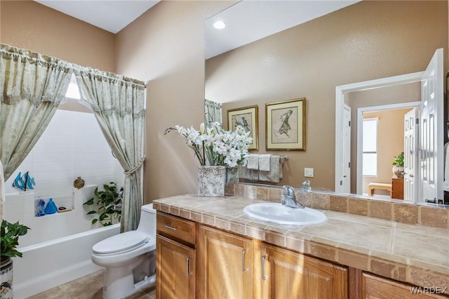 full bath with shower / tub combo, vanity, toilet, and tile patterned floors