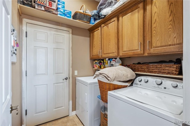 laundry area featuring cabinet space and washing machine and dryer