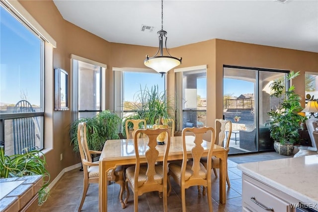 dining room with visible vents and baseboards