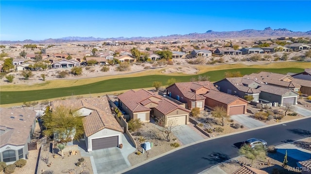 bird's eye view featuring a mountain view, view of golf course, and a residential view