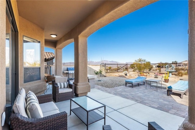 view of patio / terrace featuring grilling area, outdoor lounge area, and fence