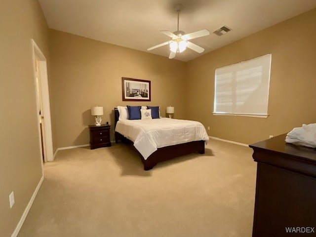 bedroom with baseboards, visible vents, ceiling fan, and light colored carpet