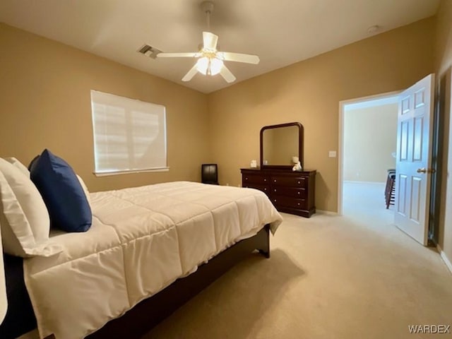 bedroom with baseboards, a ceiling fan, visible vents, and light colored carpet