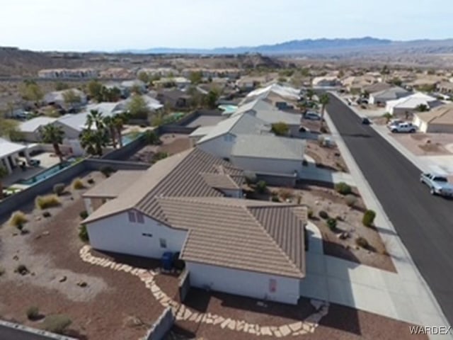 birds eye view of property with a residential view