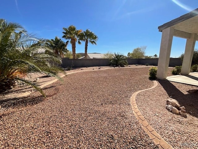 view of yard with a fenced backyard